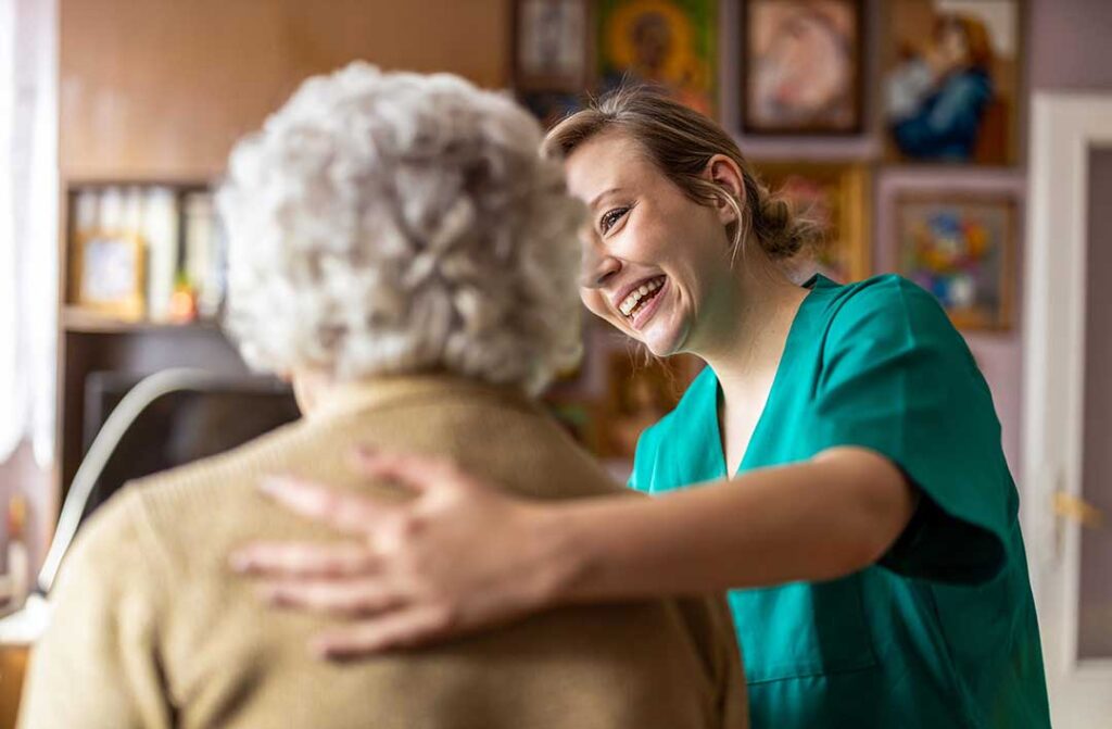 Resident and family member review a care plan and rights information at an assisted living table.